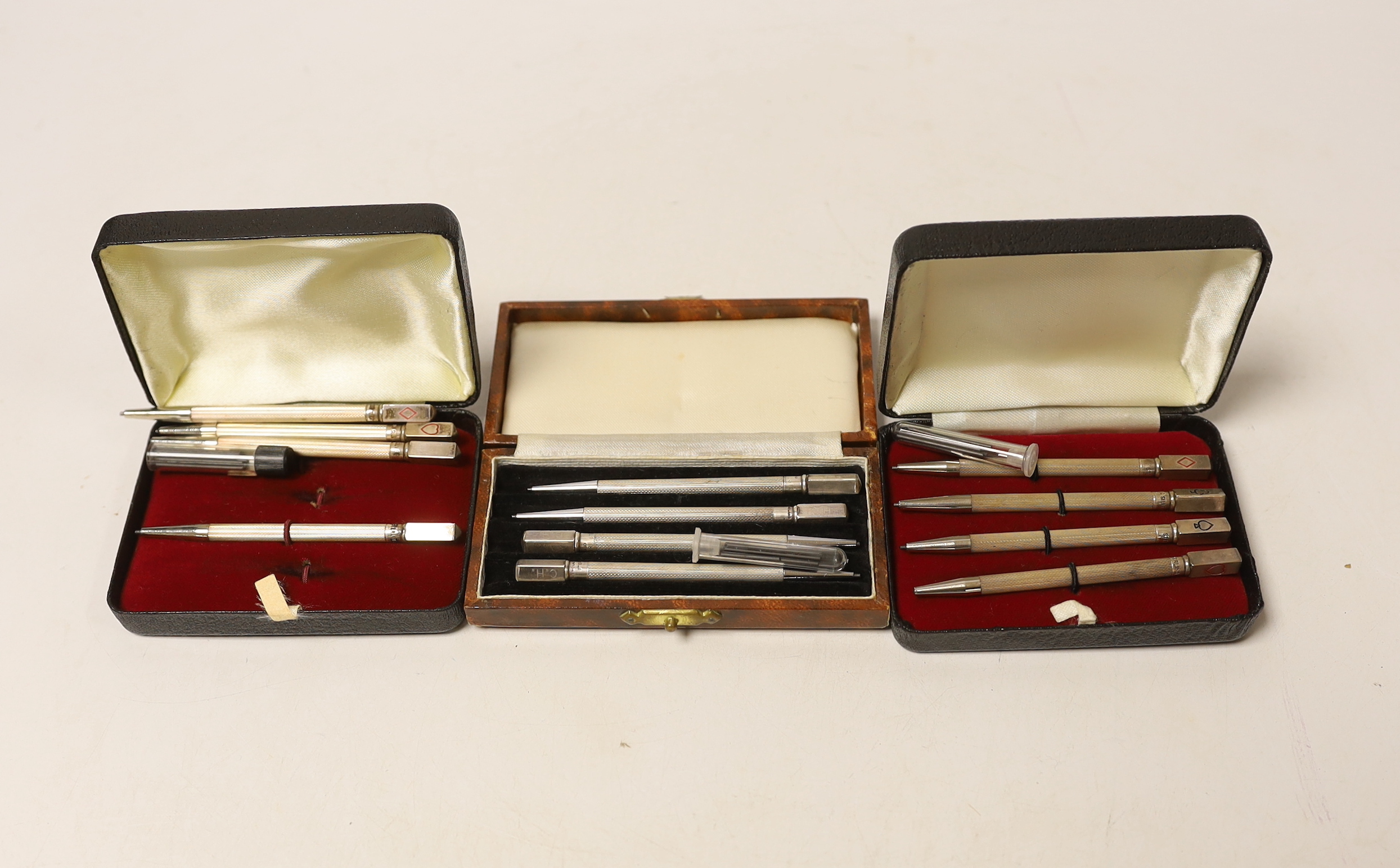 Three cased sets of sterling bridge pencils and a modern silver bookmark.